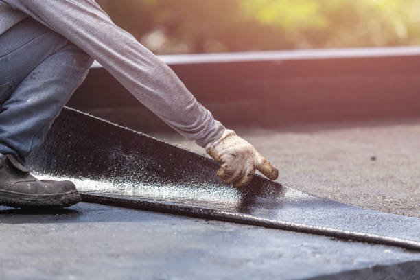 Professional Waterproofing technician working in Munith, MI